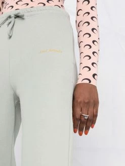 Axel Arigato pantalon de jogging à logo imprimé