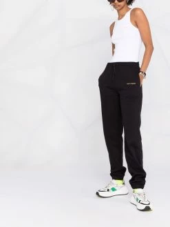 Axel Arigato pantalon de jogging à logo imprimé