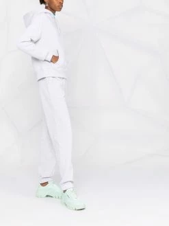 Axel Arigato pantalon de jogging à logo imprimé