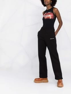 Axel Arigato pantalon de jogging à logo imprimé